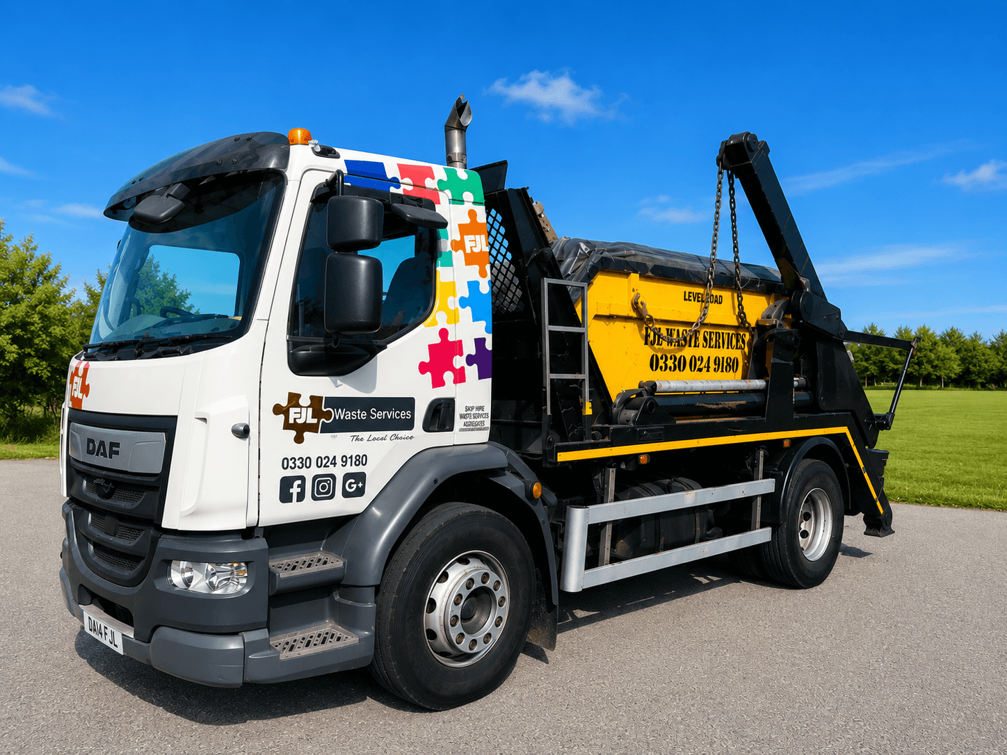 FJL Waste Services DAF skip lorry, autism-awareness livery, side view in open countryside