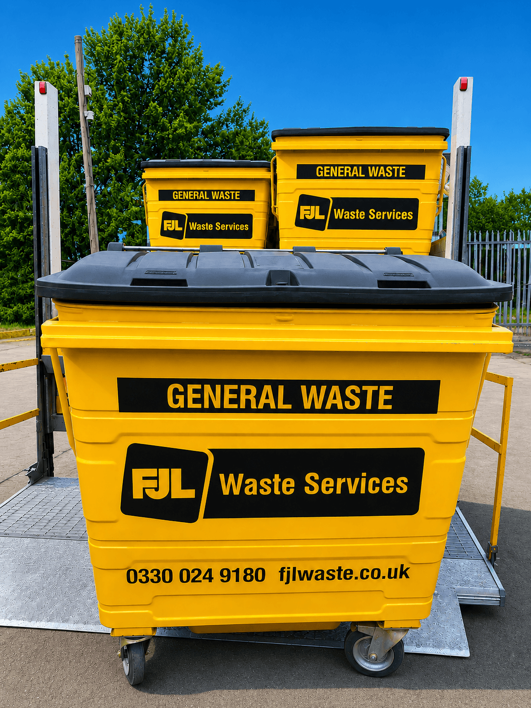 FJL Waste Services yellow general waste wheelie bins stacked with FJL branding