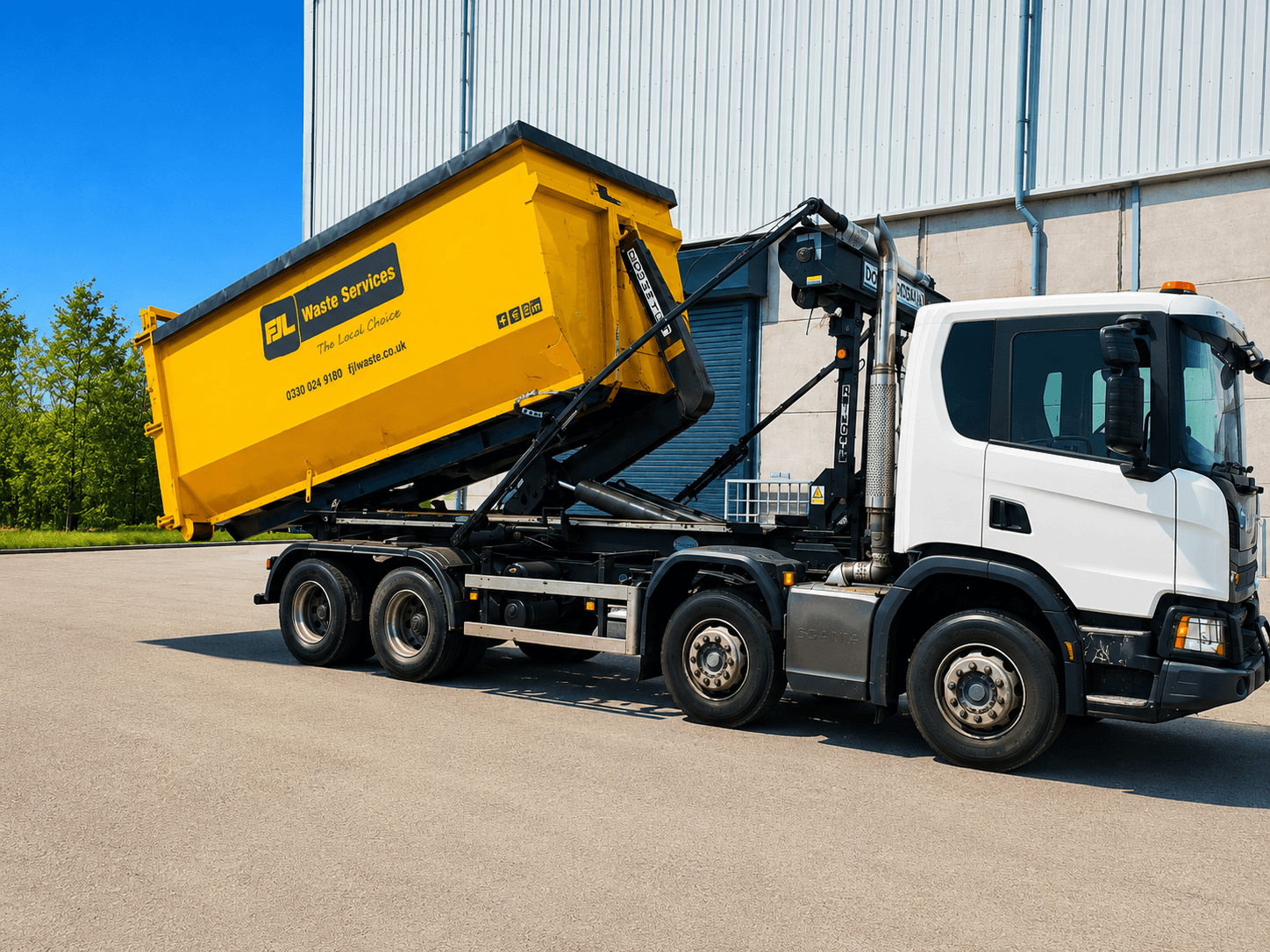 FJL Waste Services Scania hookloader lorry carrying a yellow skip